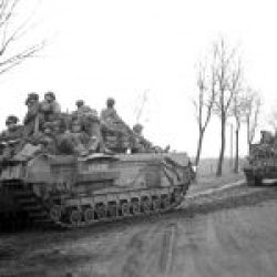 Churchill tanks carrying troops of the British 6th Airborne Division on the advance to Coesfeld, Germany, March 1945