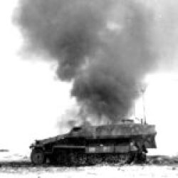 Diret hit by a the tank this German half-track burning is out of action