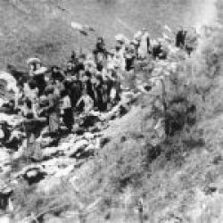 Einsatzgruppen soldiers shooting Jews who are in a ditch-1