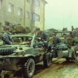 German troops with a Schwimmwagen, BMW R75 motorcycle and other vehicles during their surrender to US forces, 1945