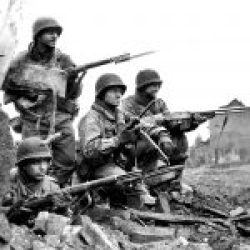 Heavily armed american soldiers during the Battle of The Bulge