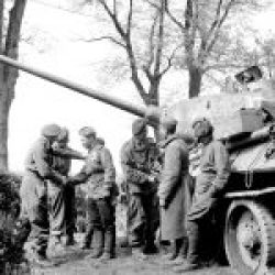 Men of the British 6th Airborne Division greet the crew of a Russian T-34 tank near Wismar, 1945