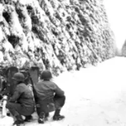 Soldiers of the 83rd Infantry Division man an anti-tank gun in the Ardennes near Revigny, midway between Houffalize and St. Vith, Belgium. December, 1944