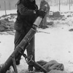 The ‘Colmar Pocket’, the last German foothold west of the Rhine, is eliminated. A GI loads a M2 4.2 inch Mortar