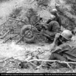 US 37-MM AT gun prepares to fire point-blank at a Japanese pillbox. The 383-IR, 96-ID found this small weapon effective.