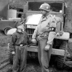 sergeant_francis_daggertt_with_a_15_year_old_German_soldier_Kronach_Germany_1945